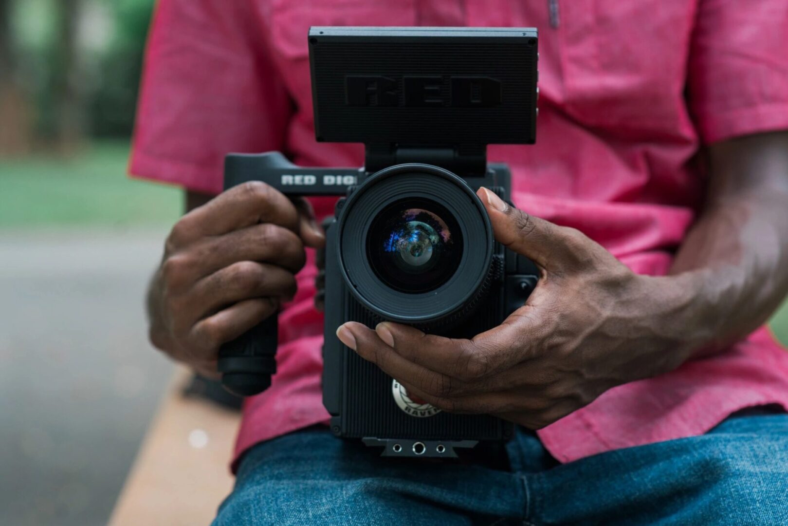 A person holding a camera in their hands.